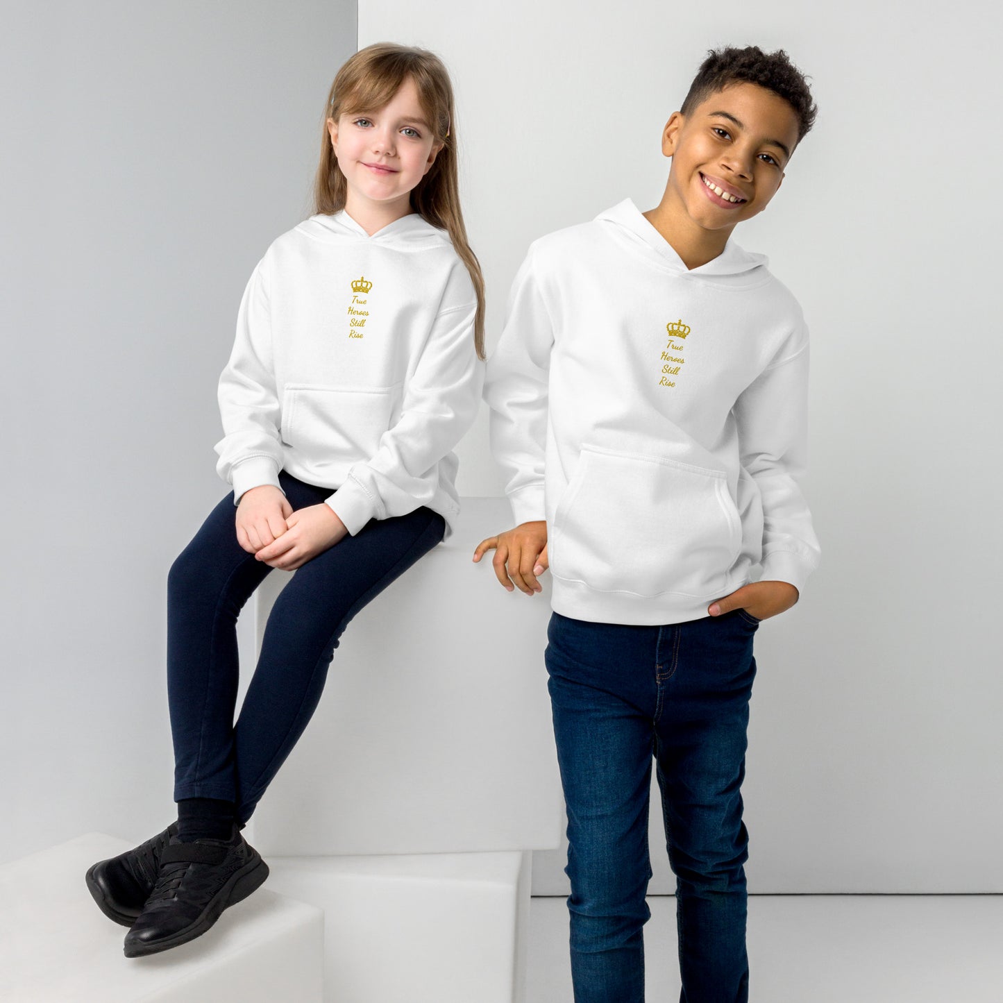 THSR Youth Pullover Hoodies with Center-Chest Logo – Black or White Pullover Hoodies Featuring Gold "True Heroes Still Rise" under a crown Design for Kids