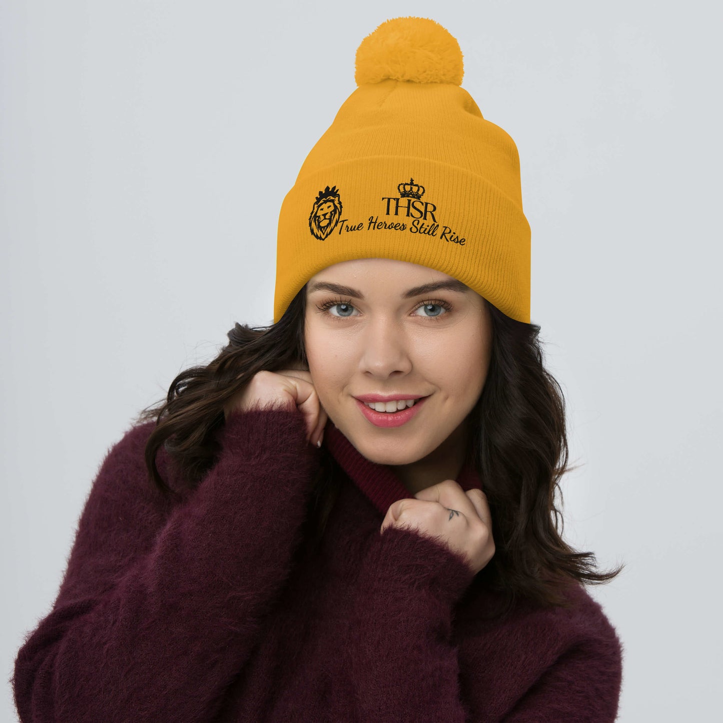 THSR Gold Pom-Pom Beanie with Black Embroidered THSR KING Lion & Crowned THSR True Heroes Still Rise Logo – Warm, Stylish Winter Hat